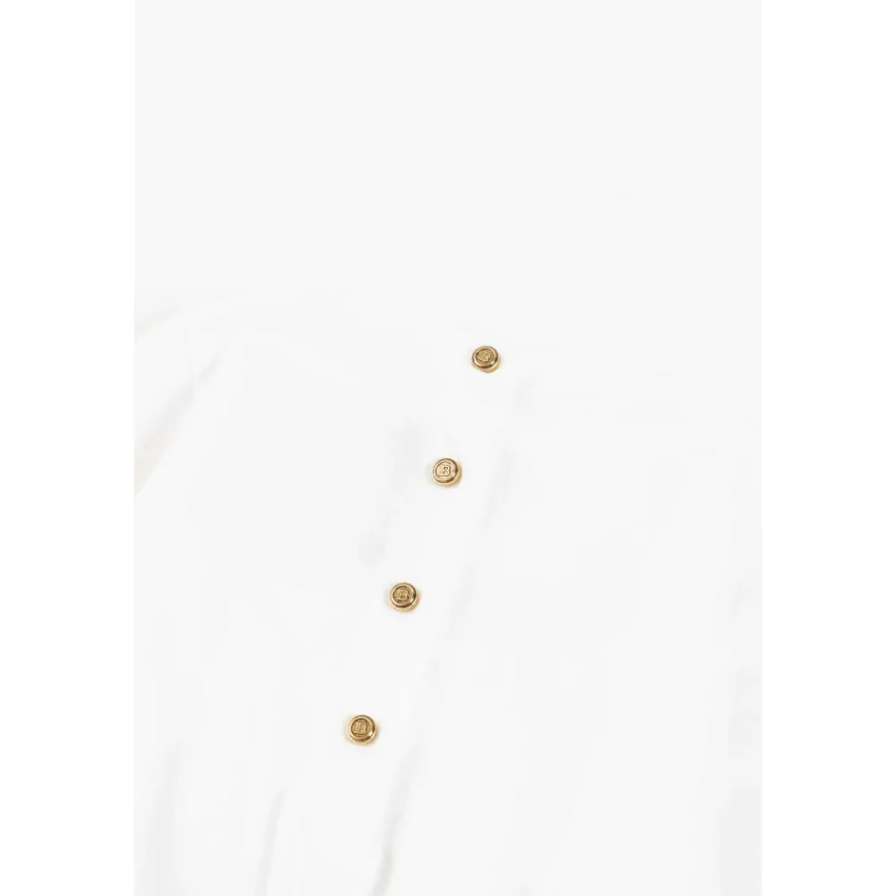 Balmain Elegante Stro Jumpsuit met Lange Mouwen en Geribbelde Manchetten